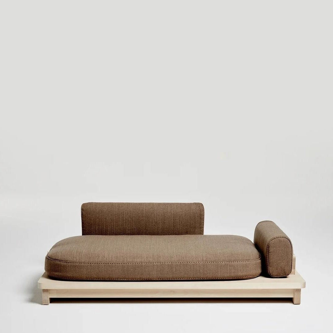 Modern pet sofa with wooden frame and brown cushion on a light gray background
