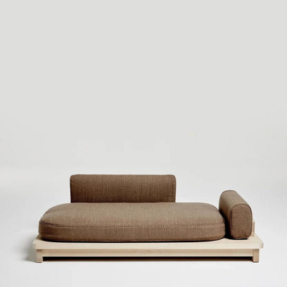 Modern pet sofa with wooden frame and brown cushion on a light gray background