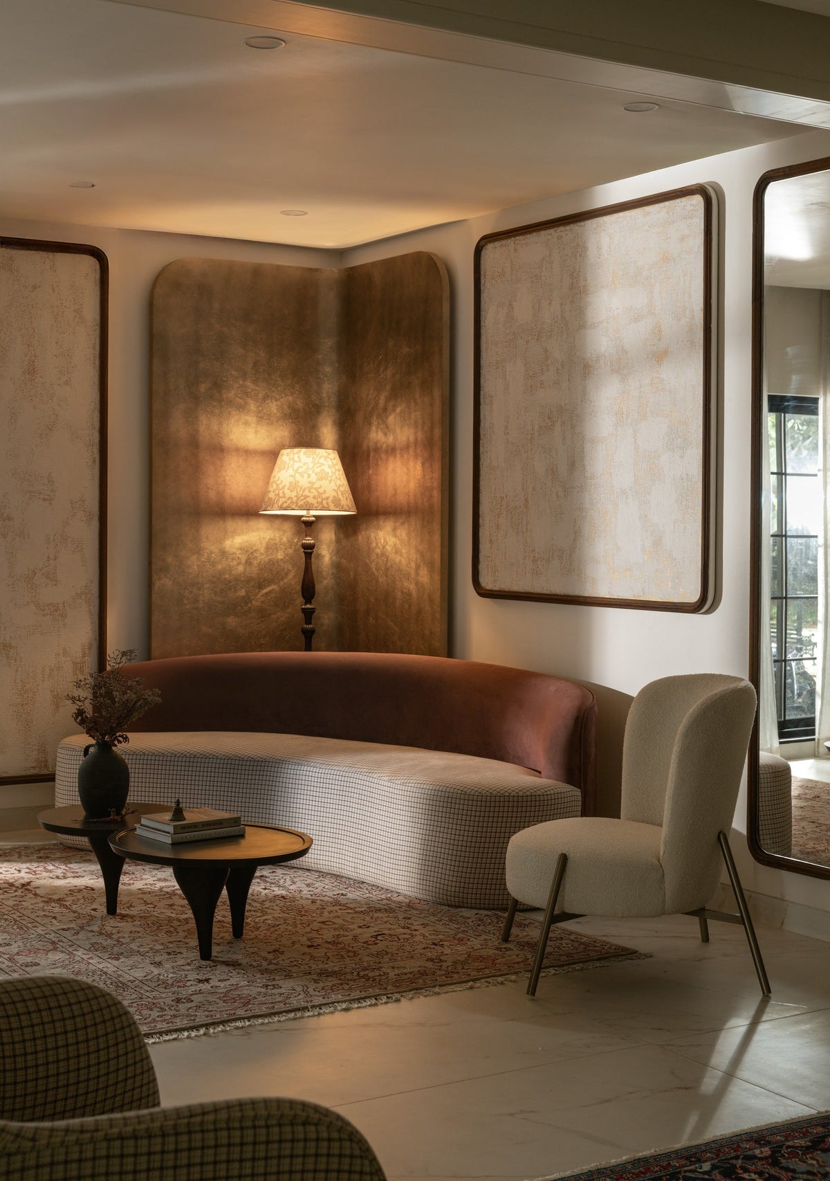 A bespoke curved sofa in a warmly lit lounge