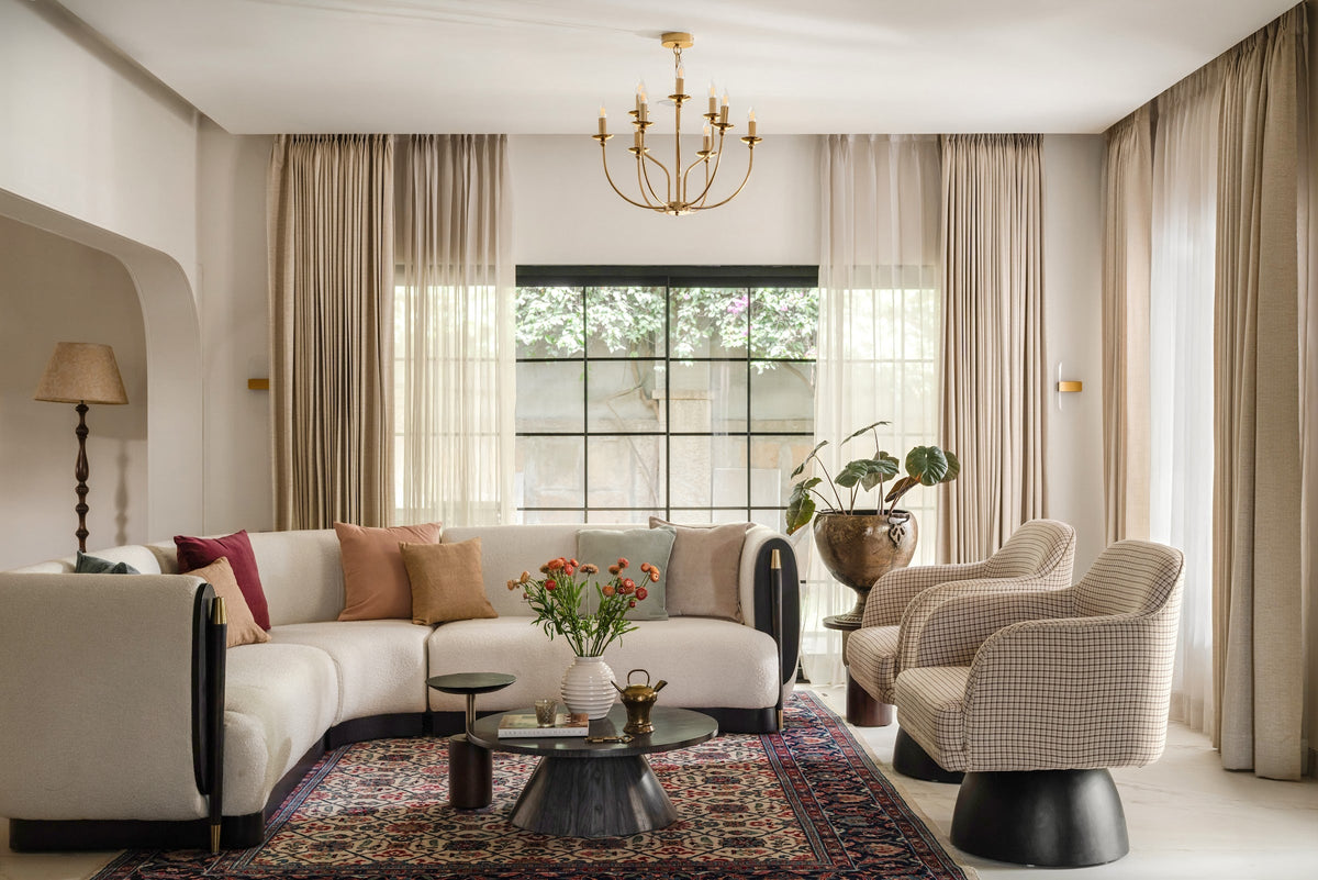 A Flamingo Life sectional couch and swivel chairs in a sunlit living room